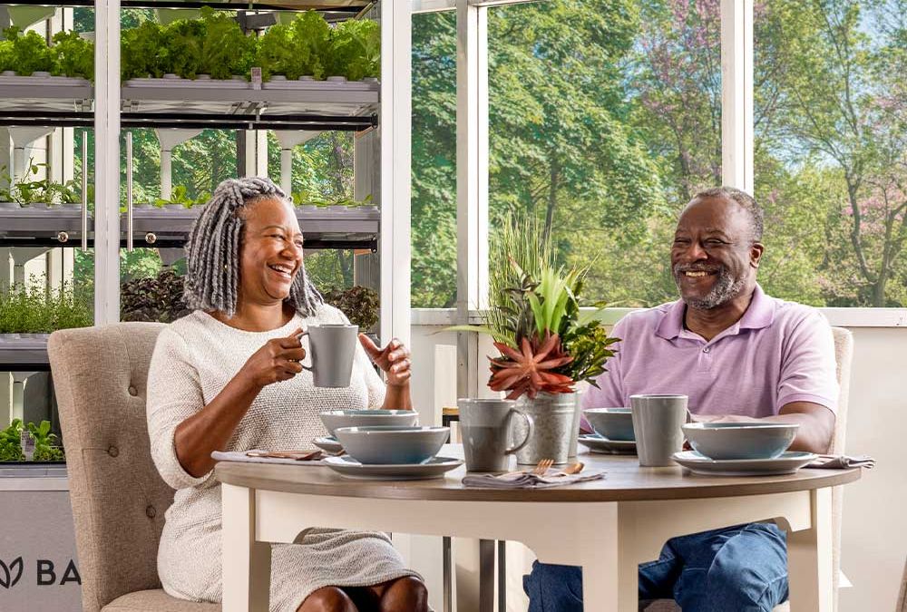 Couple in senior living center enjoying a meal at a table